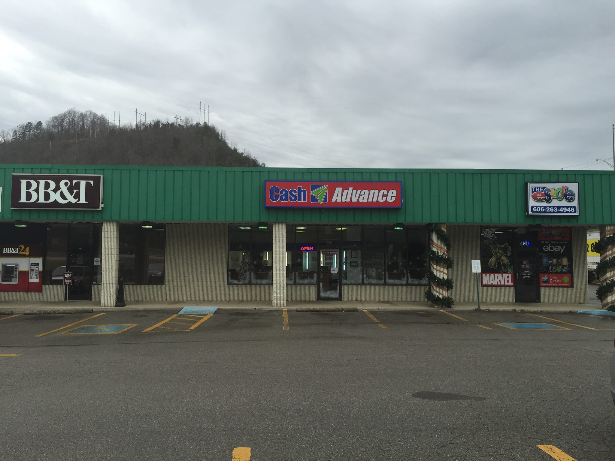 Prestonsburg shopping-plaza frontage, including the Cash Advance storefront. Photograph date unknown.